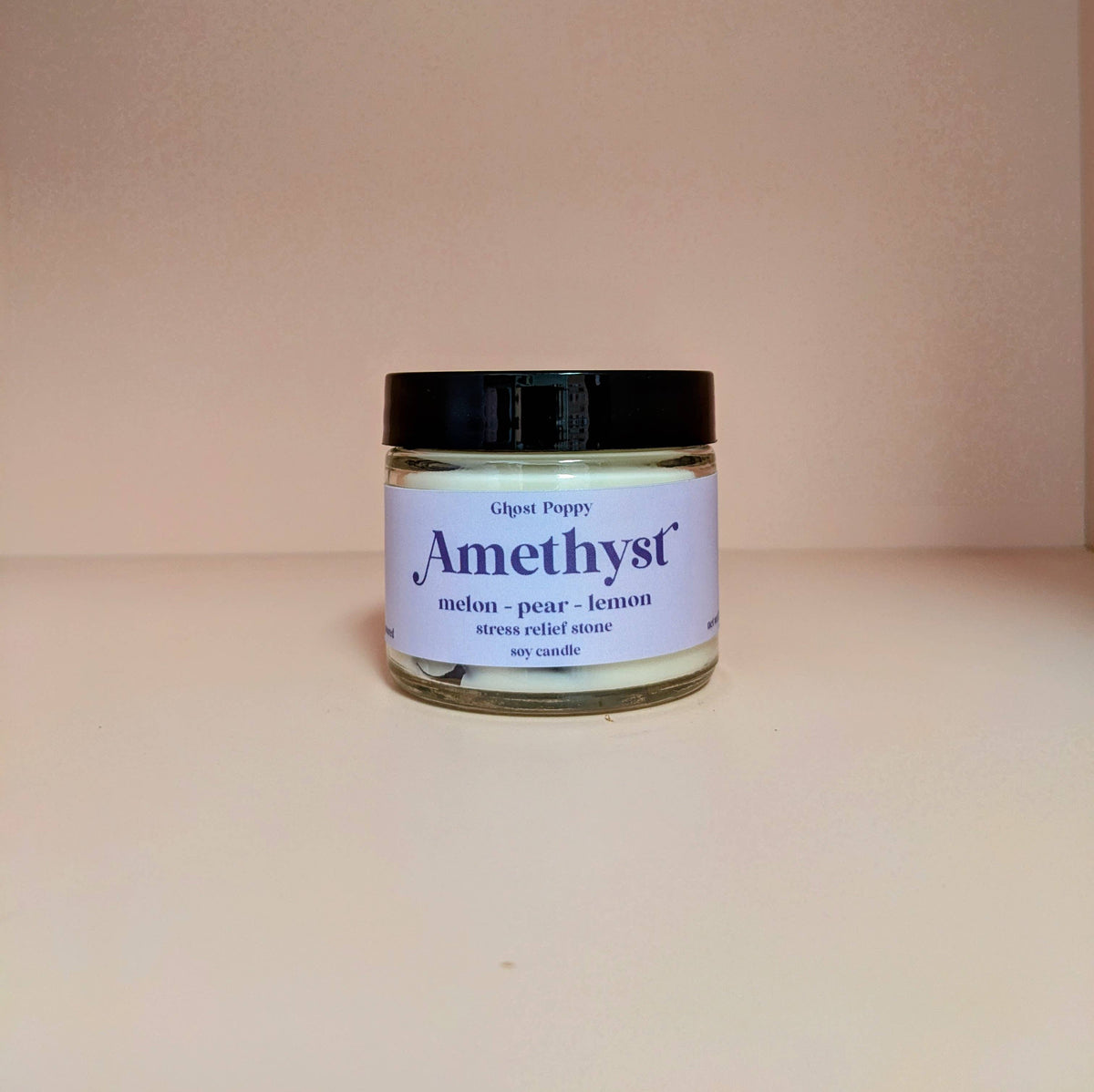 Amethyst soy candle with real crystals and melon, pear and lemon fragrance