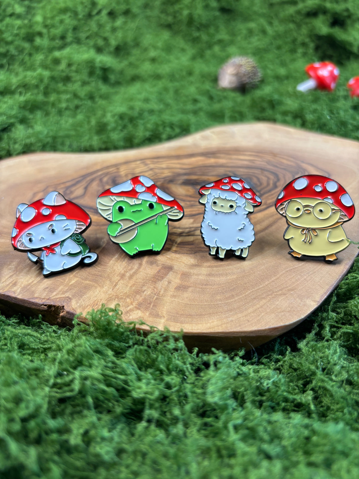 Whimsical Mushroom Friends enamel pins featuring cat, frog, sheep and bird designs