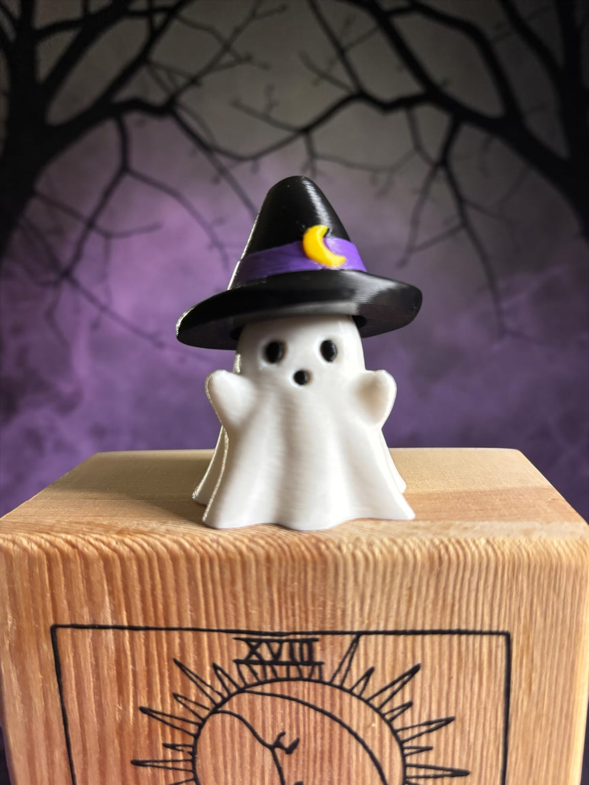 3D printed ghost clicker fidget wearing black witch hat with purple band and crescent moon